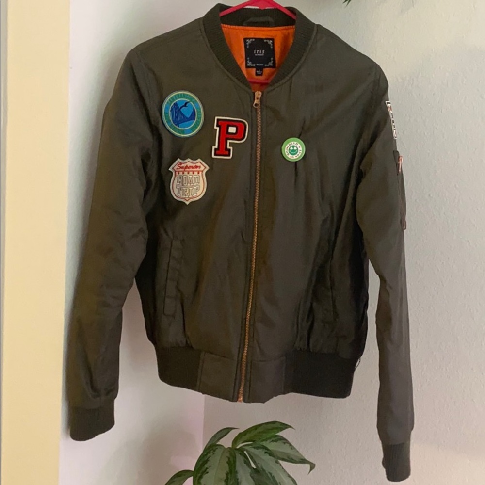 Olive green bomber jacket with patches